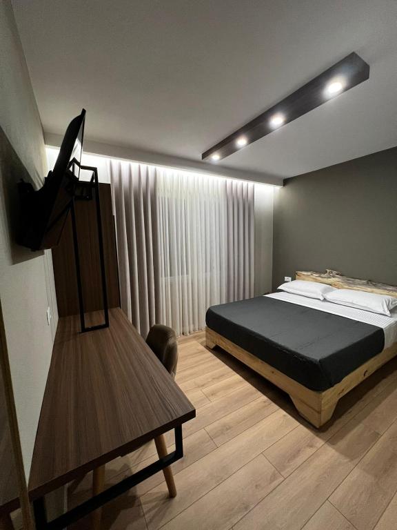 Postel nebo postele na pokoji v ubytování Hotel Ikona