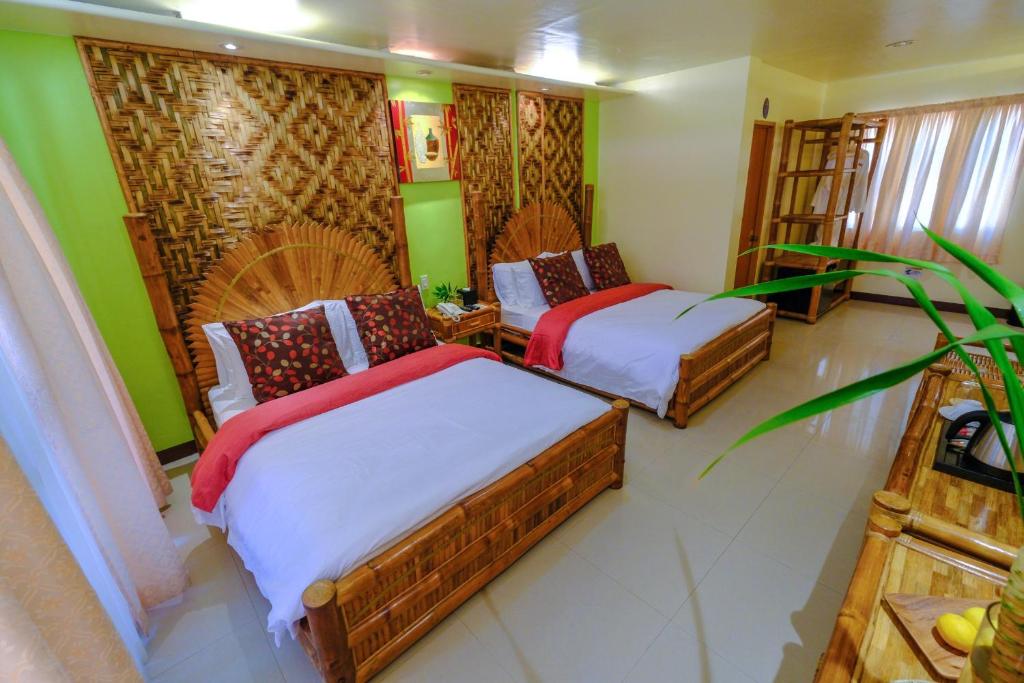 Postel nebo postele na pokoji v ubytování Malapascua Exotic Island Dive Resort