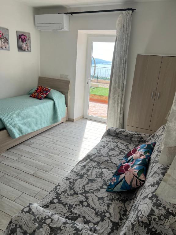 Postel nebo postele na pokoji v ubytování Agriturismo Un Mare di Fiori