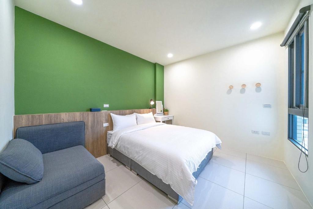 Ένα ή περισσότερα κρεβάτια σε δωμάτιο στο Little House Homestay