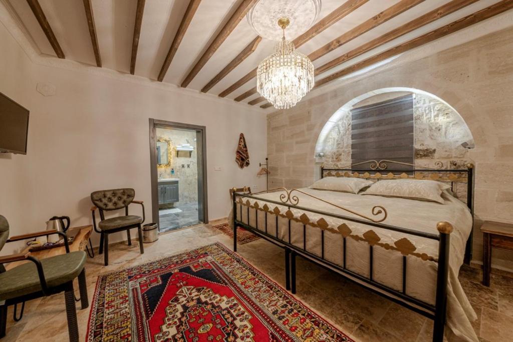 Postel nebo postele na pokoji v ubytování Cappadocia Vera Inn
