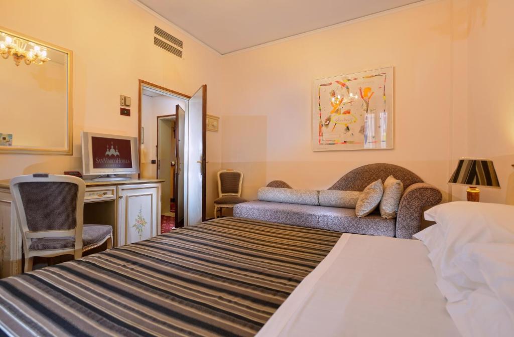 Postel nebo postele na pokoji v ubytování Albergo Cavalletto & Doge Orseolo
