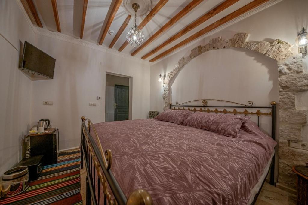 Postel nebo postele na pokoji v ubytování Cappadocia Vera Inn