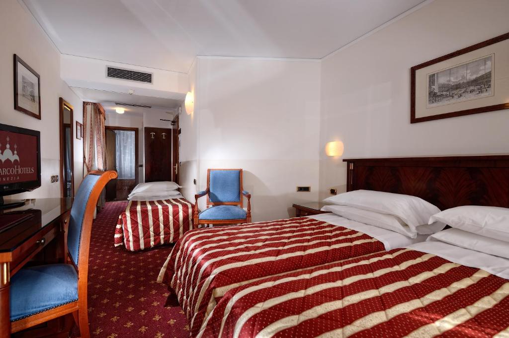 Postel nebo postele na pokoji v ubytování Albergo Cavalletto & Doge Orseolo