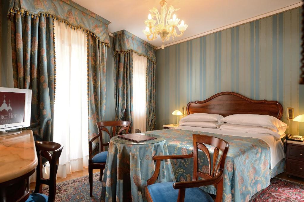 Postel nebo postele na pokoji v ubytování Albergo Cavalletto & Doge Orseolo