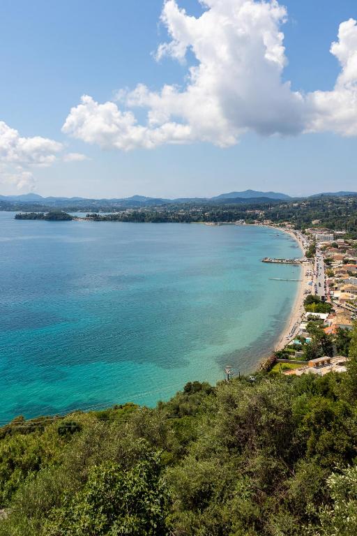 a view of a beach and the ocean at Rena's house Corfu in Ágios Márkos