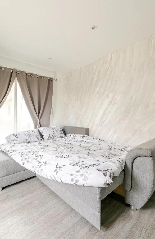 Postel nebo postele na pokoji v ubytování Maisonnette avec terrasse
