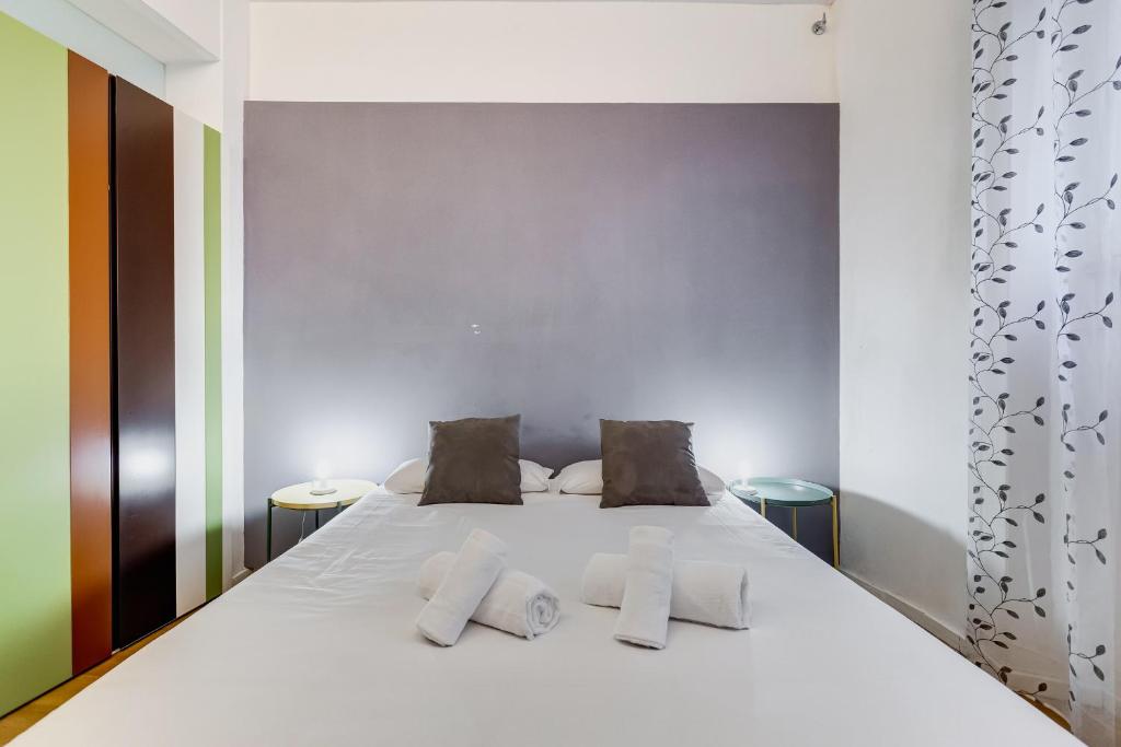 Łóżko lub łóżka w pokoju w obiekcie VIVILO COLLECTION - Statonia Design Apartment