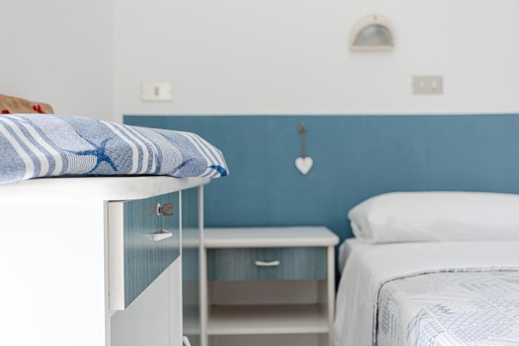A bed or beds in a room at Hotel Lucerna