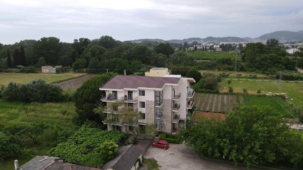 an aerial view of a building in a field at GuestHouse Moco Forest in Ulcinj
