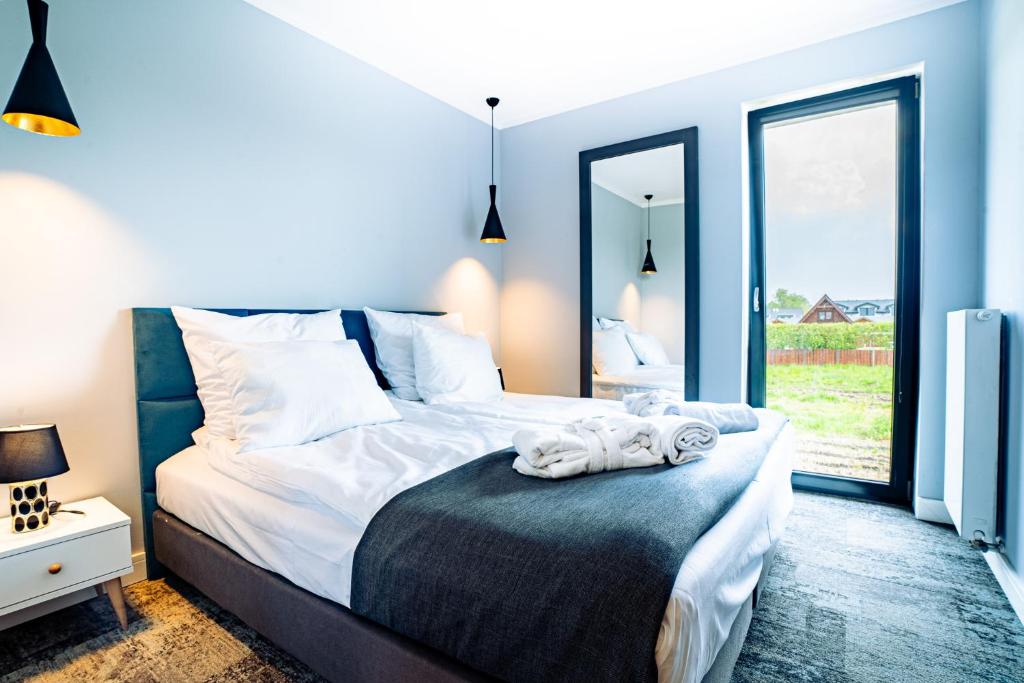 Postel nebo postele na pokoji v ubytování Mielenko & Spa ex Baltin Hotel