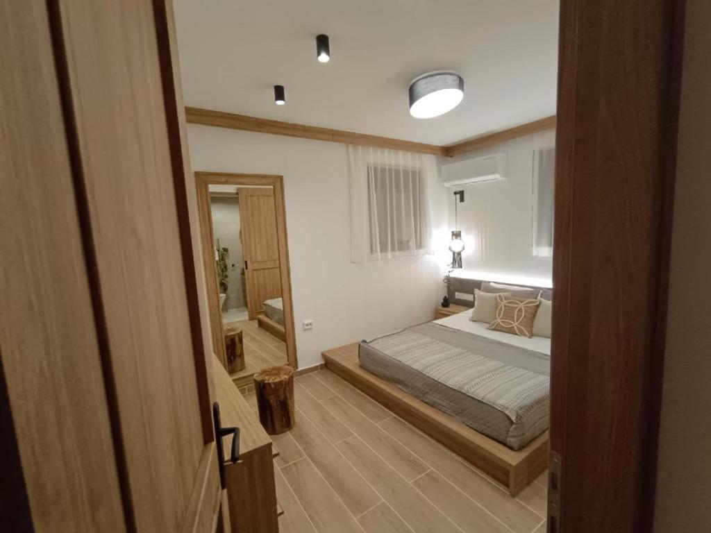 Postel nebo postele na pokoji v ubytování Arsithea Villa
