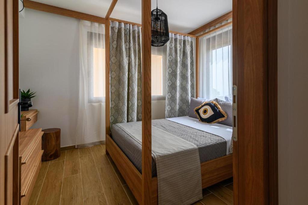 Postel nebo postele na pokoji v ubytování Arsithea Villa