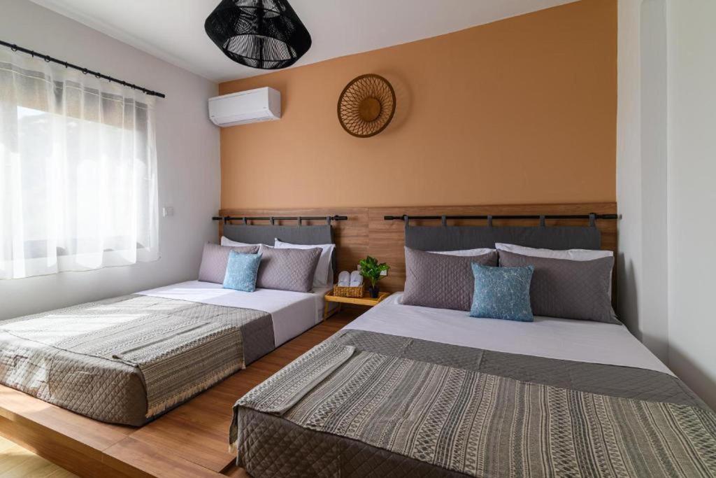 Postel nebo postele na pokoji v ubytování Arsithea Villa