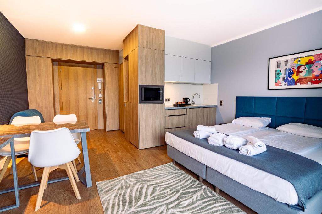 Postel nebo postele na pokoji v ubytování Mielenko & Spa ex Baltin Hotel