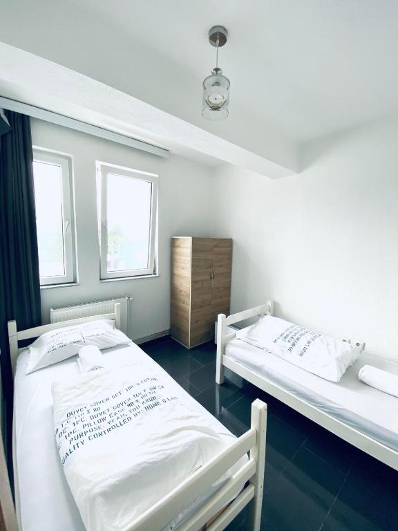 Postel nebo postele na pokoji v ubytování Hostel Heimli