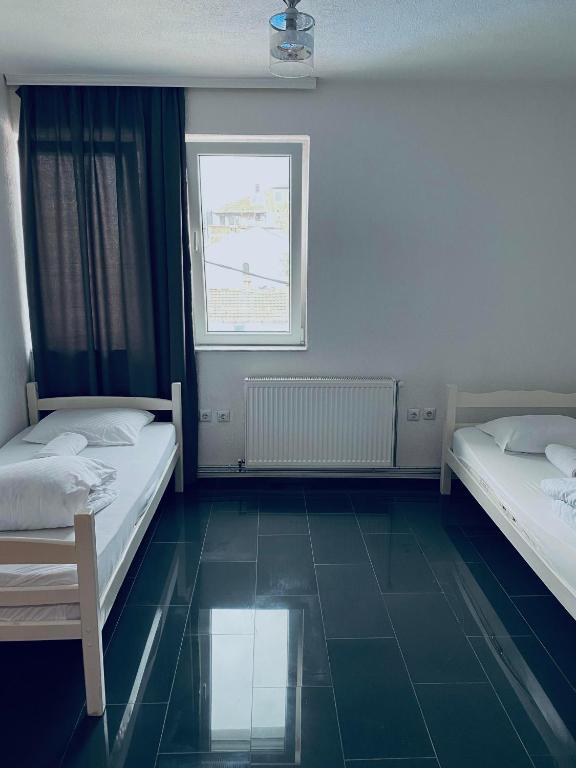 Postel nebo postele na pokoji v ubytování Hostel Heimli