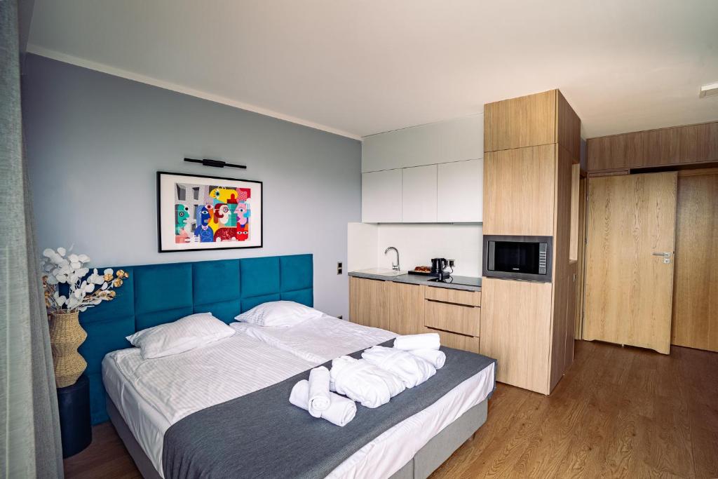 Postel nebo postele na pokoji v ubytování Mielenko & Spa ex Baltin Hotel