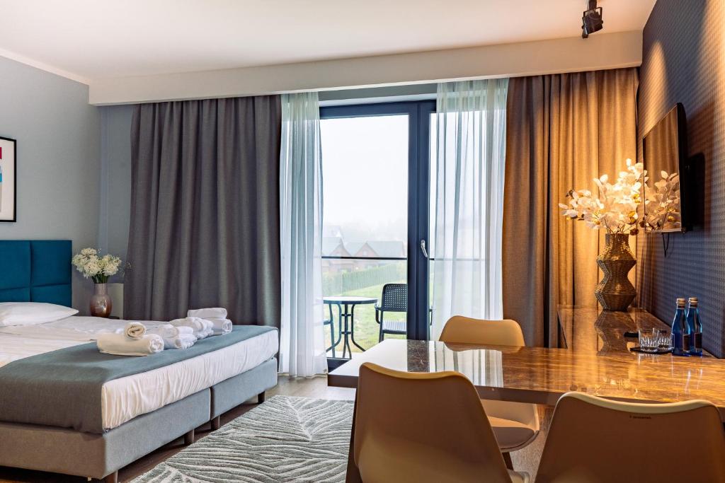 Postel nebo postele na pokoji v ubytování Mielenko & Spa ex Baltin Hotel