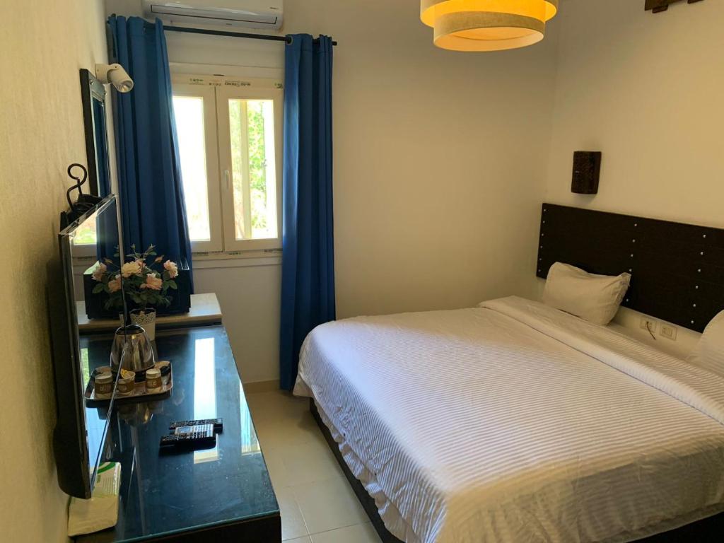 Postel nebo postele na pokoji v ubytování Ios Hotel & Village