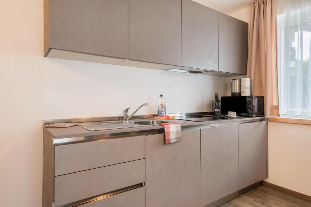 Kuchnia lub aneks kuchenny w obiekcie Apartment Cater Residence Bun Ste