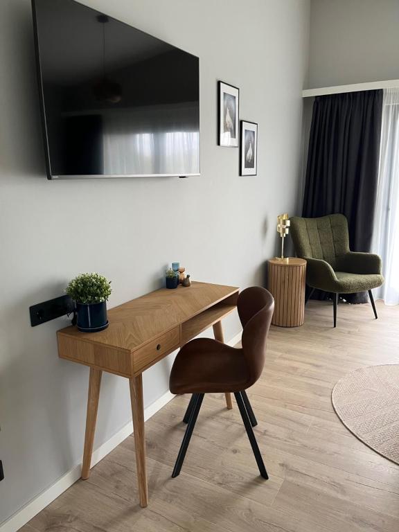 TV a/nebo společenská místnost v ubytování Hotel Hamar