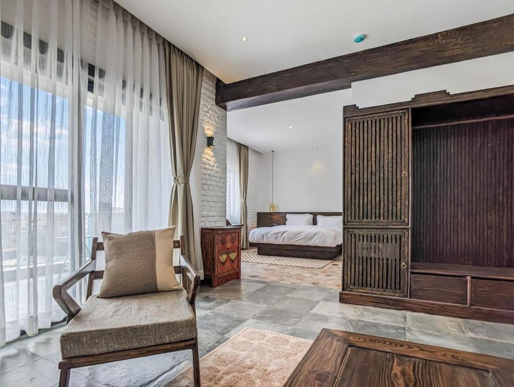 Postel nebo postele na pokoji v ubytování Uma Residence and Suites