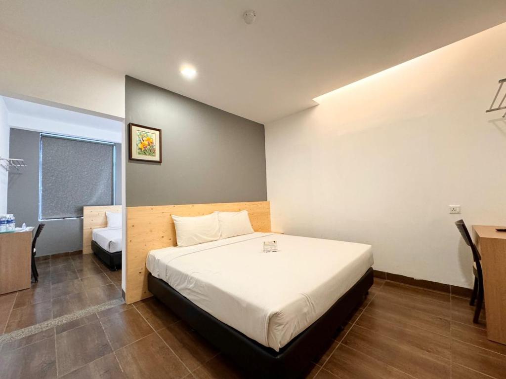 Postel nebo postele na pokoji v ubytování Hotel Sunflower - HLS