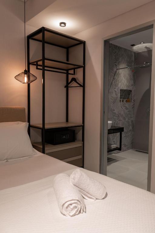 Postel nebo postele na pokoji v ubytování Litan Hotel