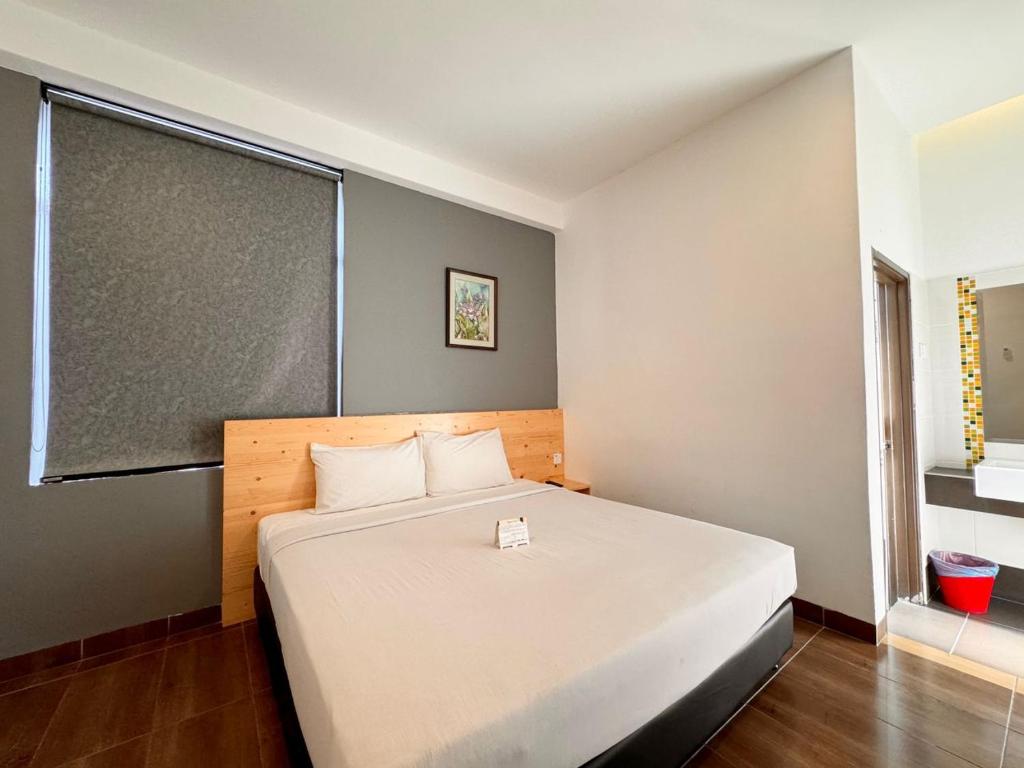 Postel nebo postele na pokoji v ubytování Hotel Sunflower - HLS