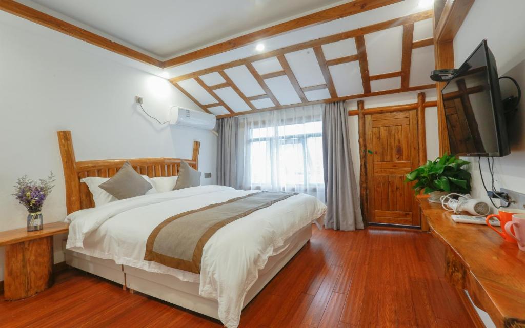 Ένα ή περισσότερα κρεβάτια σε δωμάτιο στο Easy House Gaoyun Branch