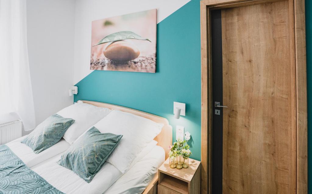 Postel nebo postele na pokoji v ubytování Gál Apartman Szeged -Keco-