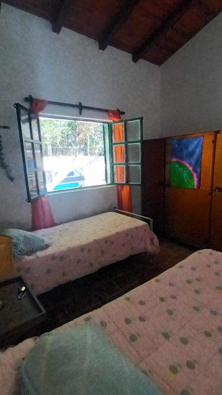 Postel nebo postele na pokoji v ubytování Casa Semilla Hospedaje de Montaña