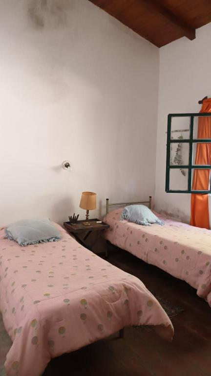 Postel nebo postele na pokoji v ubytování Casa Semilla Hospedaje de Montaña