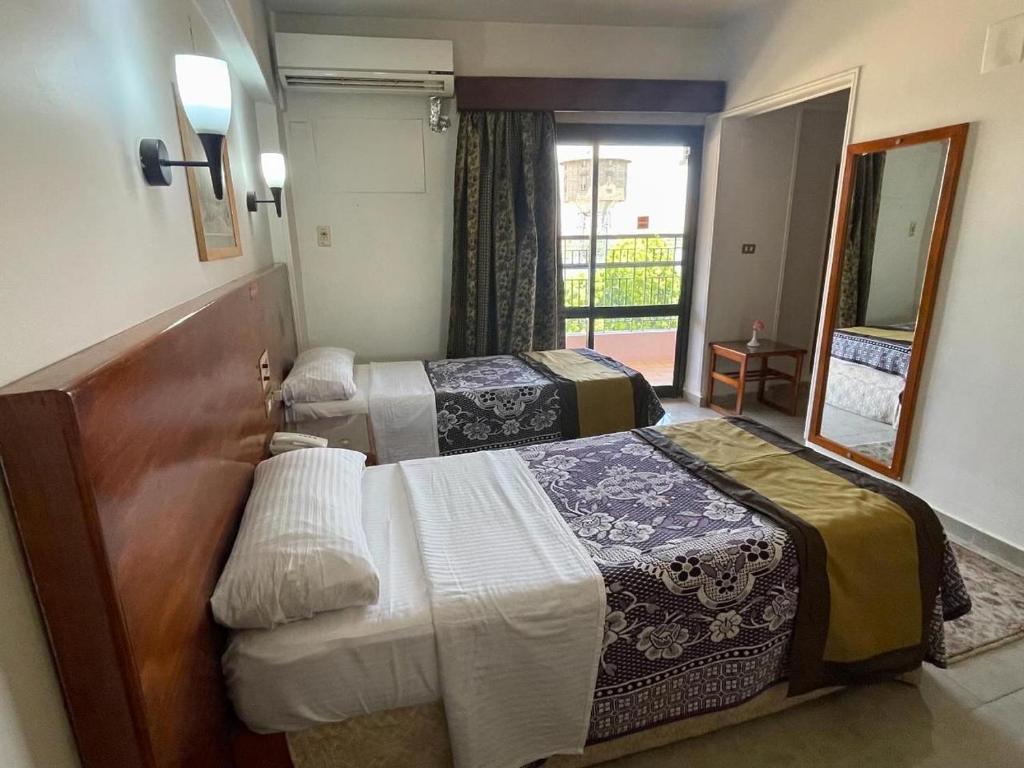Postel nebo postele na pokoji v ubytování St.Joseph Hotel