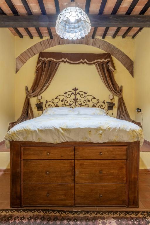 Postel nebo postele na pokoji v ubytování Mulino di Castelvecchio