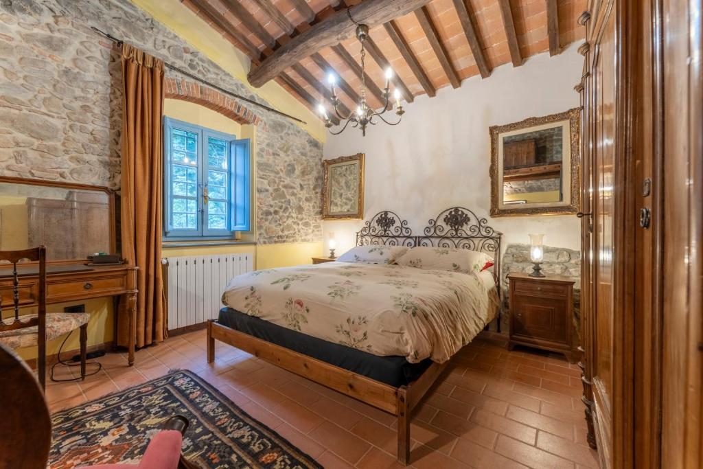 Postel nebo postele na pokoji v ubytování Mulino di Castelvecchio