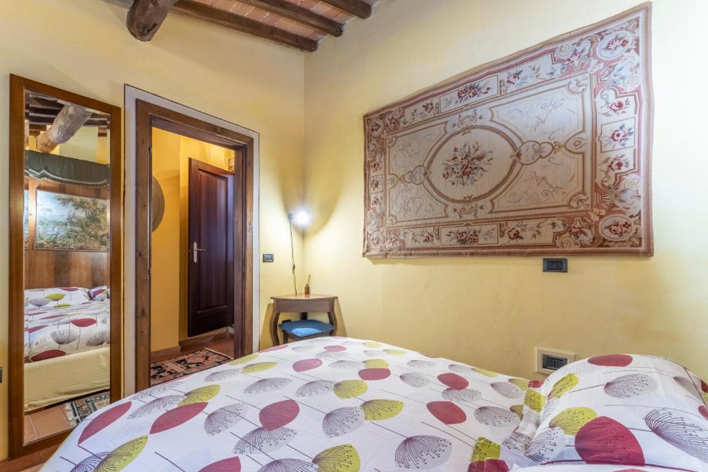 Postel nebo postele na pokoji v ubytování Mulino di Castelvecchio