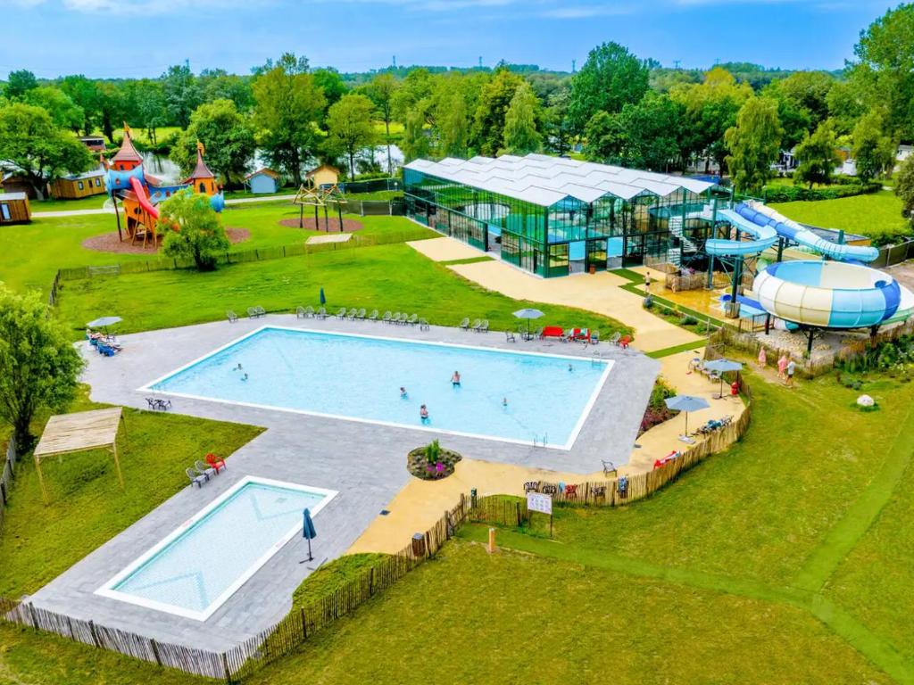 an aerial view of a swimming pool at a park at Vakantiepark Vlinderloo in Enschede