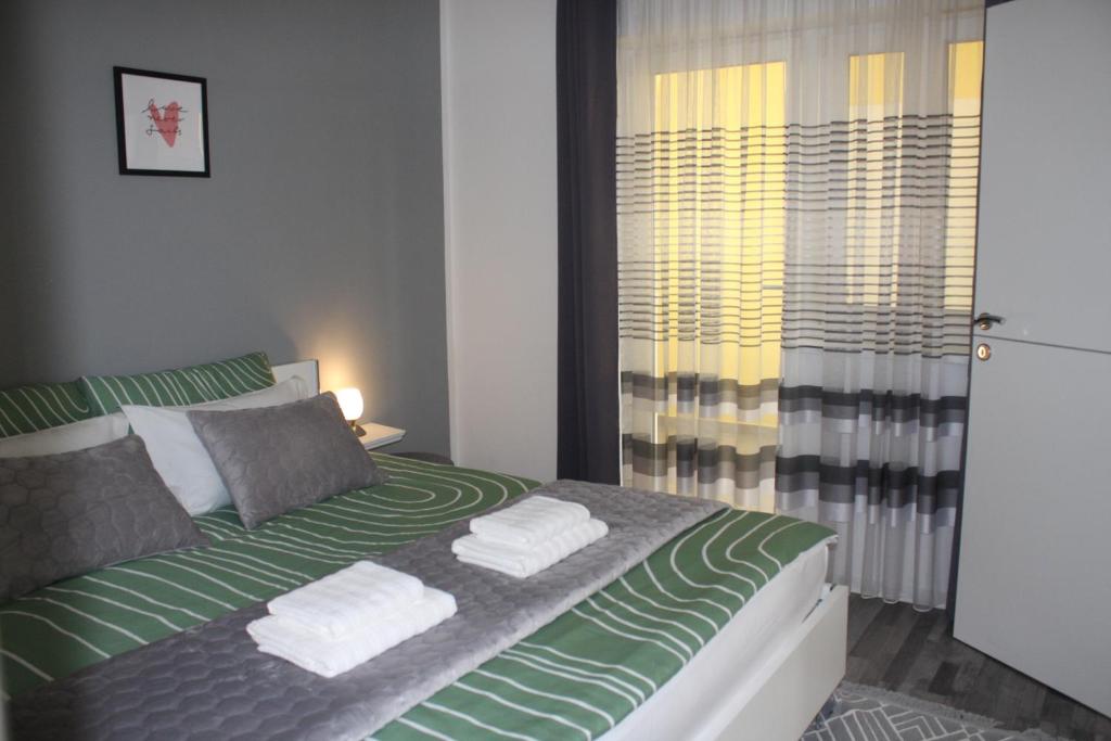 Postel nebo postele na pokoji v ubytování Apartman Hakuna Matata