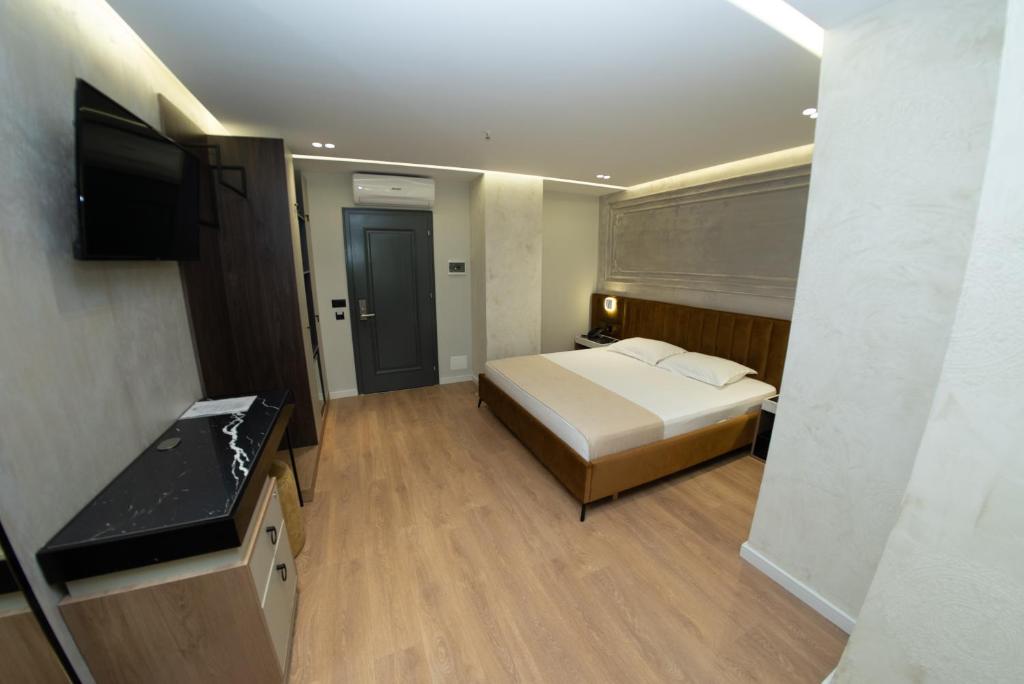 Postel nebo postele na pokoji v ubytování Hotel Monopoly