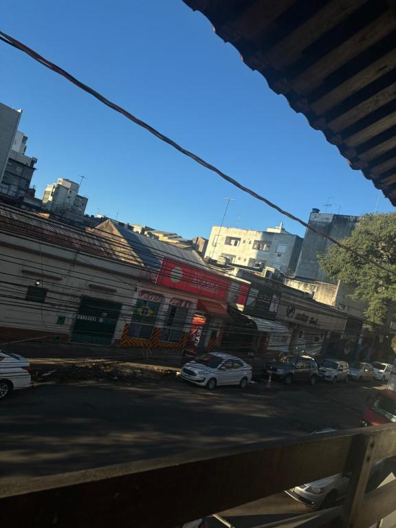 a city street with cars parked on the street at Hotel CasaBlanca in Santana do Livramento