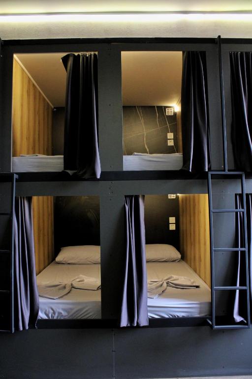Ένα ή περισσότερα κρεβάτια σε δωμάτιο στο Hostel 90pods & C O working