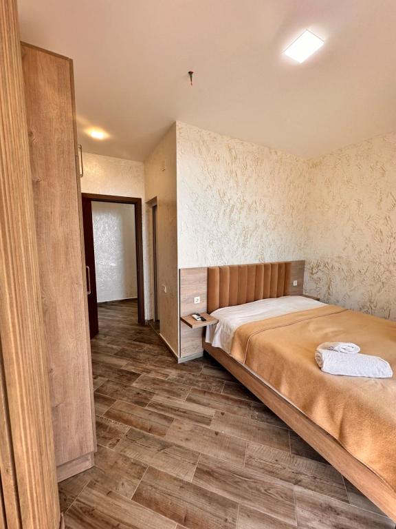 Postel nebo postele na pokoji v ubytování Green Cape Tower