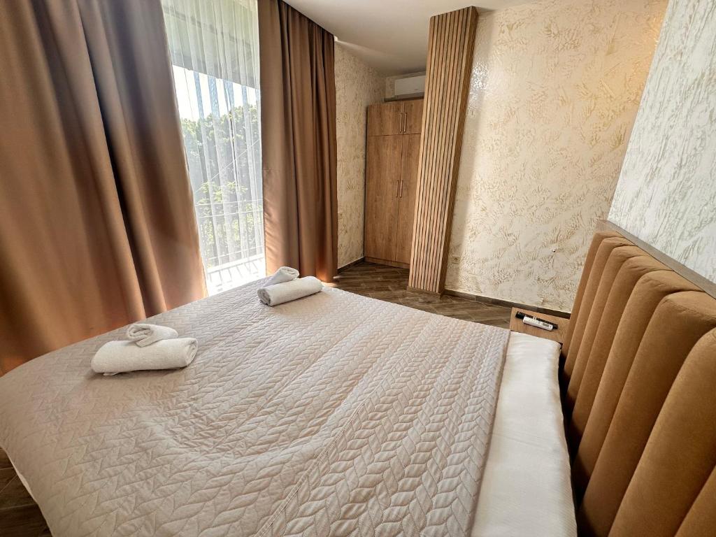 Postel nebo postele na pokoji v ubytování Green Cape Tower