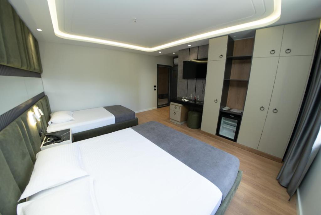 Postel nebo postele na pokoji v ubytování Hotel Monopoly