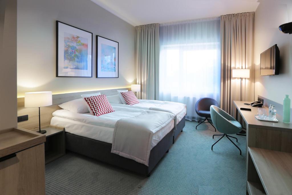 Ένα ή περισσότερα κρεβάτια σε δωμάτιο στο Hotel FairPlayce