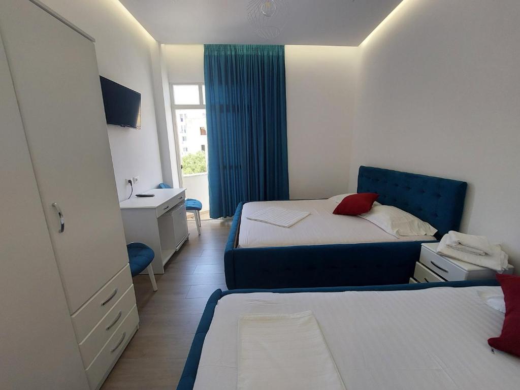 Postel nebo postele na pokoji v ubytování GRAND HOTEL eae
