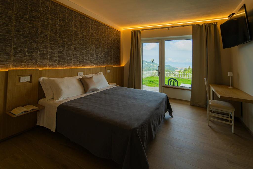 Postel nebo postele na pokoji v ubytování B&B Lo Zefiro
