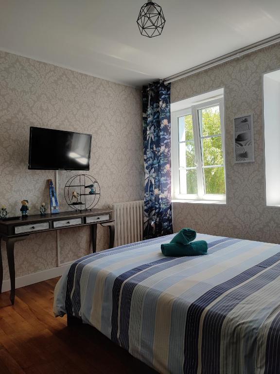 Postel nebo postele na pokoji v ubytování ARVEIL